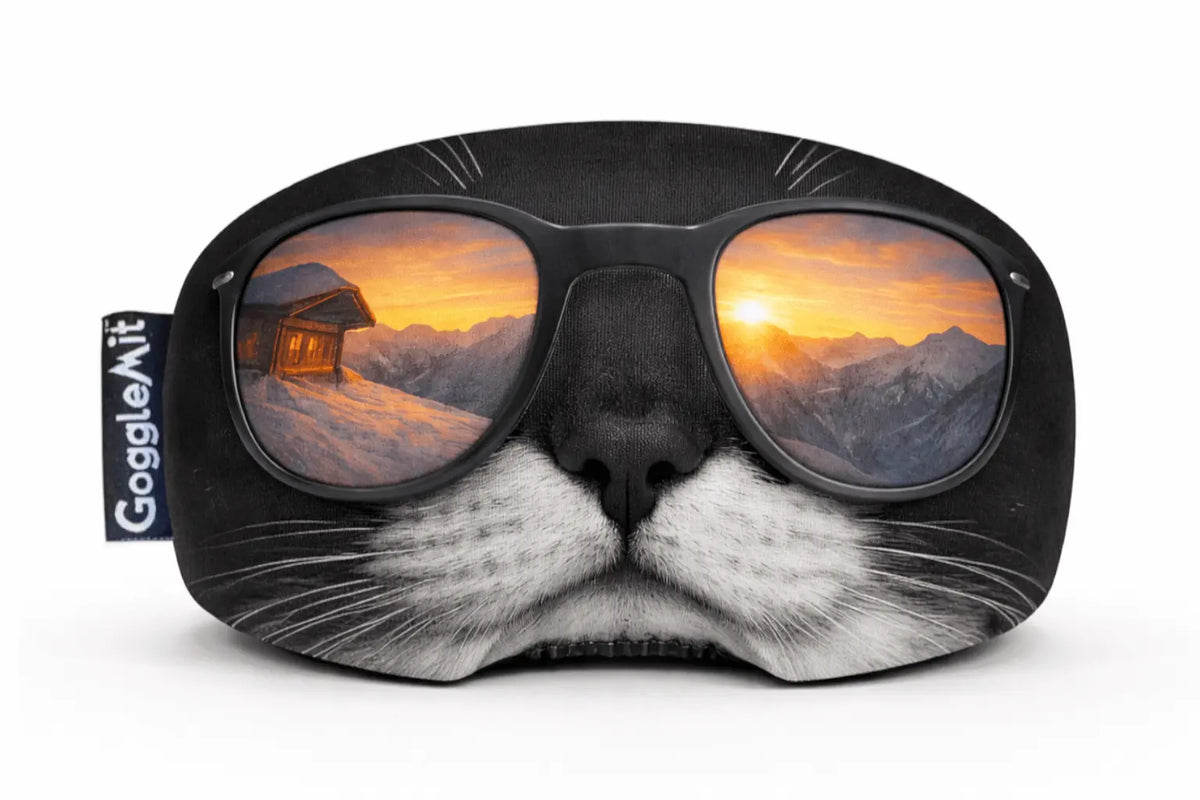 Goggle cover with an image of a chilled cat wearing sunglasses with a reflection of a mountain scene.